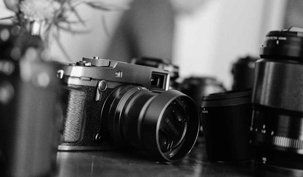 Black and white image of a camera and equipment from the Palm Springs Photo Festival