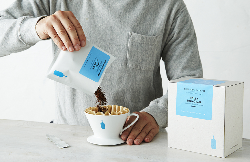 Male Pours Blue Bottle Coffee Gift Into Pour Over  