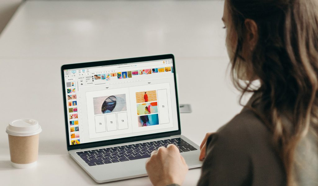 Person designing a trade book on a laptop using BookWright software.