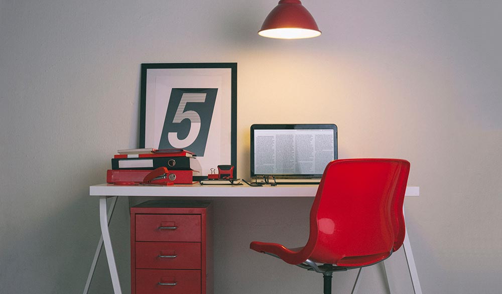 White, red and black desk space for an author
