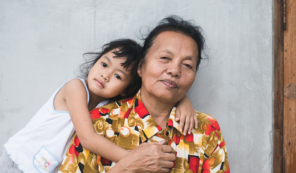 Grandchild Hugging Grandmother