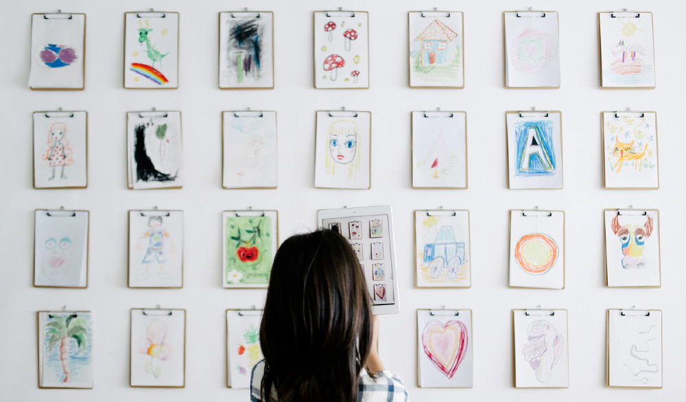 Girl playing a memory-matching activity at home for kids