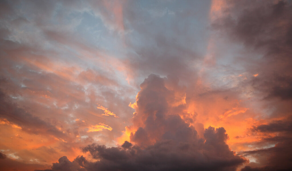 Vibrant pink, blue and orange sunset with dramatic clouds.
