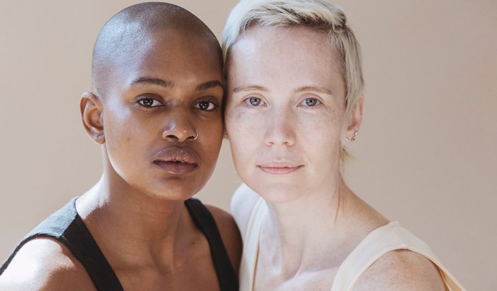 Natural beauty photography with two models without makeup staring into the camera
