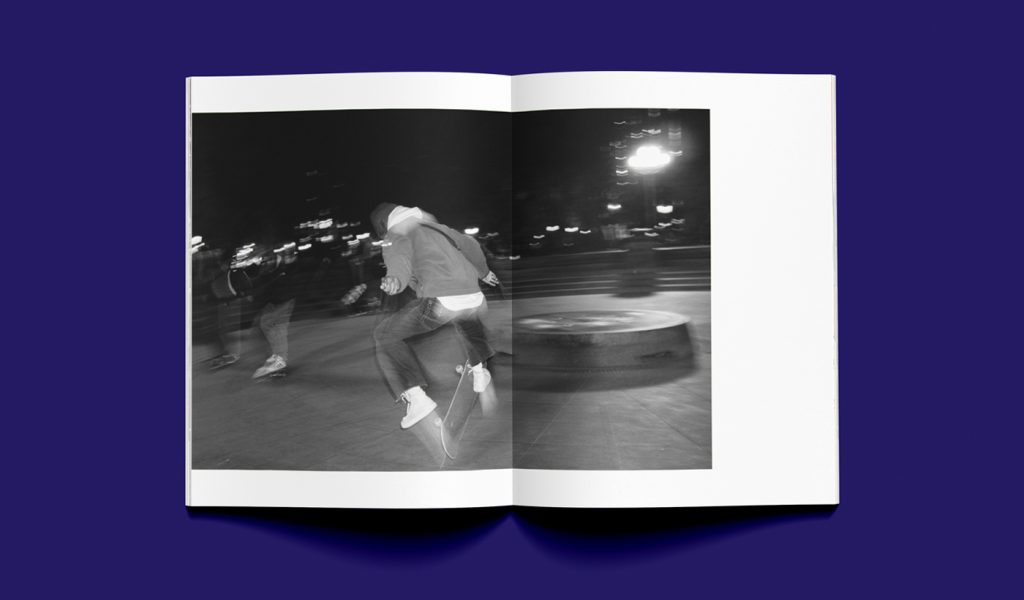 working the park zine open to a black and white photograph of a skater doing a kick flip