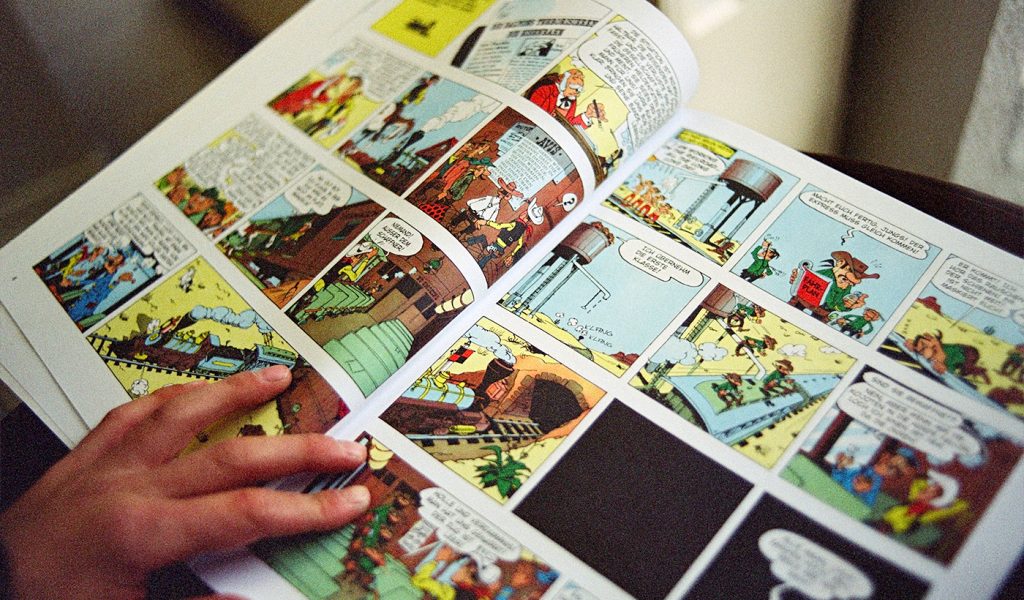 Self-published comic book open to a colorful page