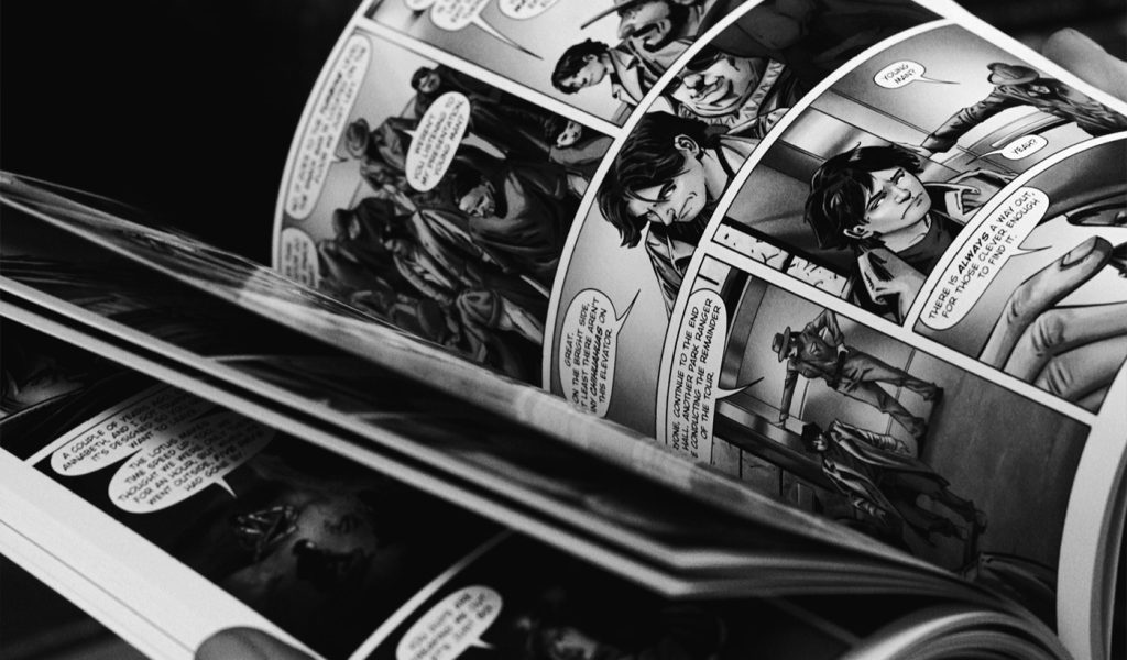 Black and white comic book held open to a page