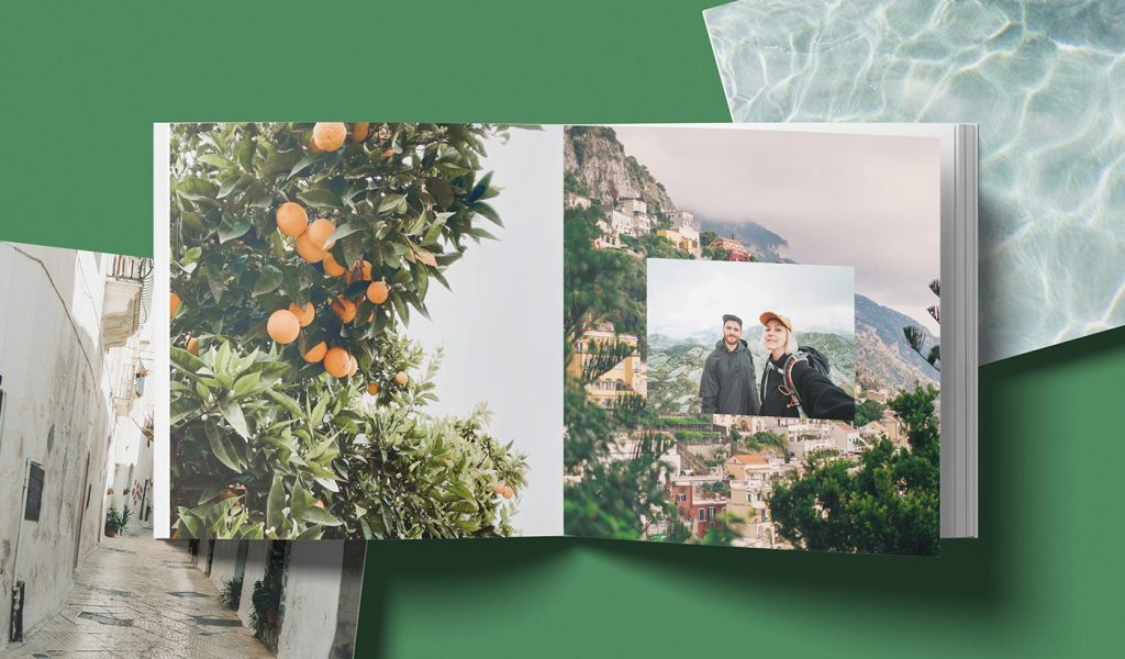 Blurb's Mini Square photo book opened up, showing an orange tree on one side and a couple traveling on the other