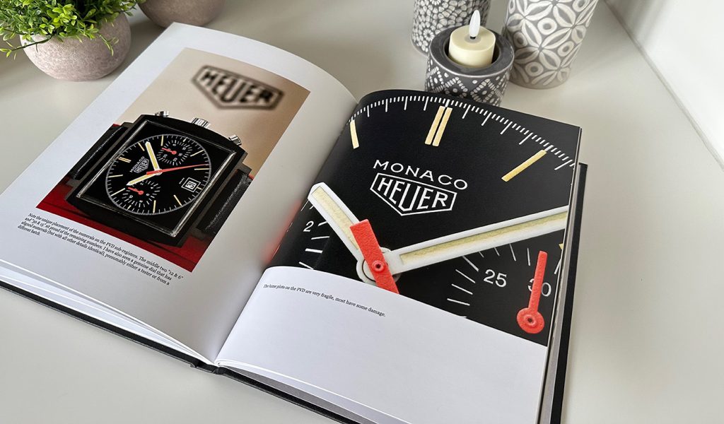 Richard Crosthwaite's Heuer Carrera Chronographs 1963-85 book opened up to show images of a Monac Heuer watch