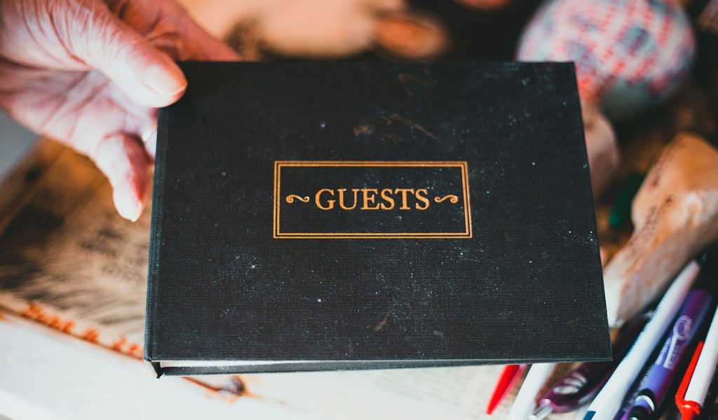 Person holding a guest book, an example of a low content book