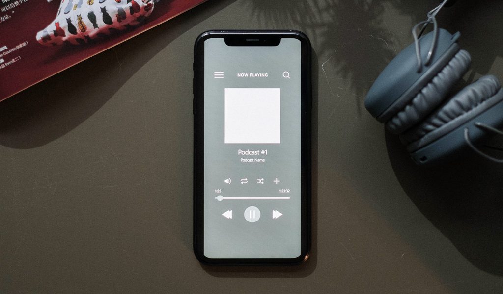 Phone with a podcast draft of a book launch open