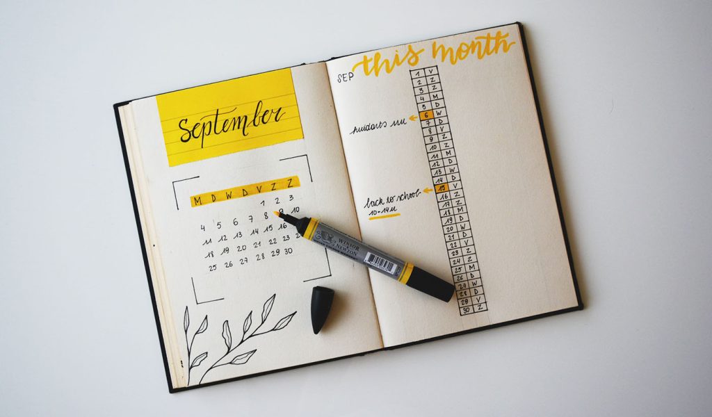 Bullet journal with September open and beautiful monthly spreads