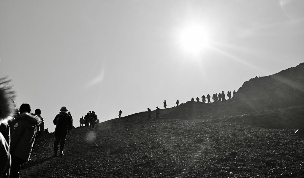 black and white photo of fellow explorers on an Antarctic expedition by Dan Milnor