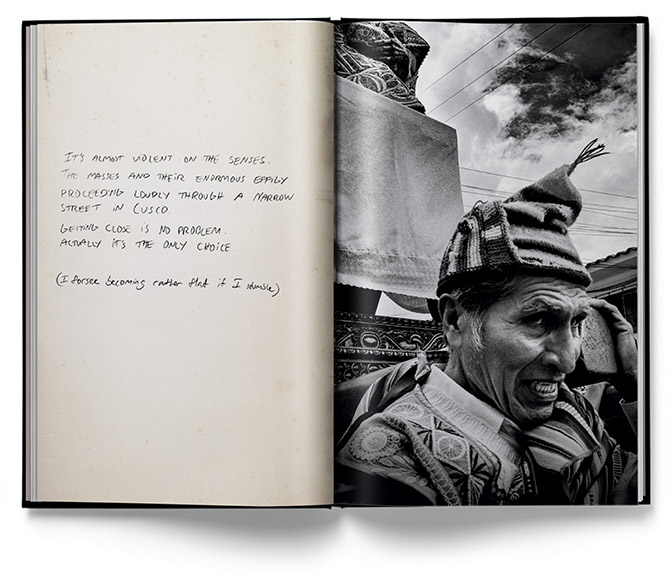 Travel photo book opened up showing handwritten text on one page and a black and white photo of a person on the other